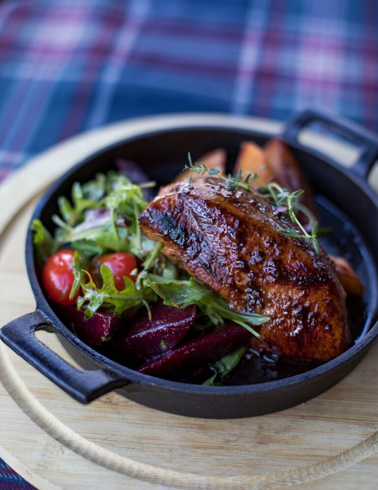 Grilled quality meat served with fresh salad and vegetables, an example of nutrient-dense animal protein